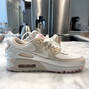 Nike Air Max white with cream/beige and lavender/pink accent.